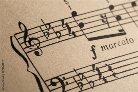 marcato music meaning: In the realm of musical notation, the term marcato is often used to describe a particular way of playing a note or phrase, but what does it truly convey beyond its literal translation?