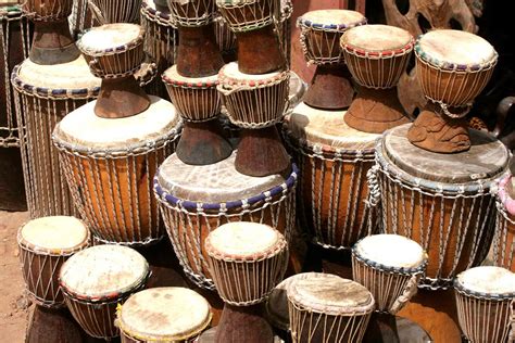 what functions did music serve in medieval west africa? And how did the rhythms of West African drumming influence the development of jazz?